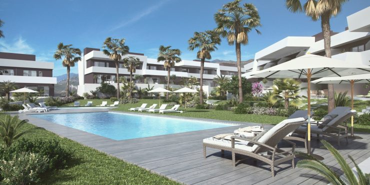 View from the pool of an urbanization with townhouses in Marbella East, Spain